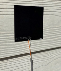 Large surface-mounted heat flux sensors on building façade